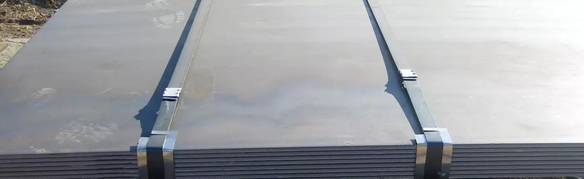 Steel plates bundled for handling